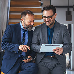 men looking at tablet